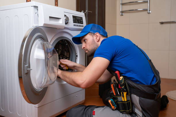Technician repairing washing machine in Dubai – Ali Maintenance Services