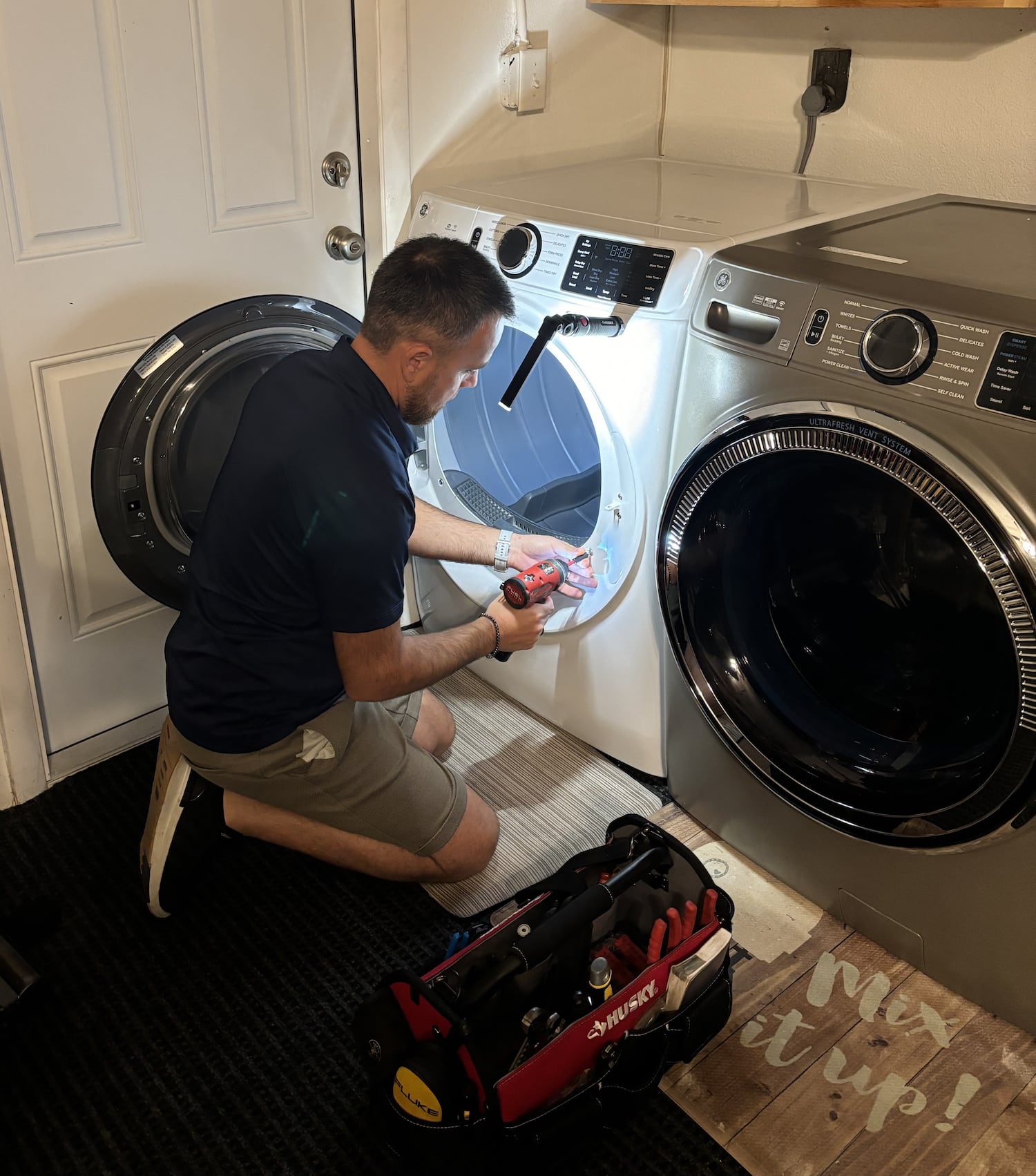 Dryer repair in Dubai by Ali Maintenance Services technician
